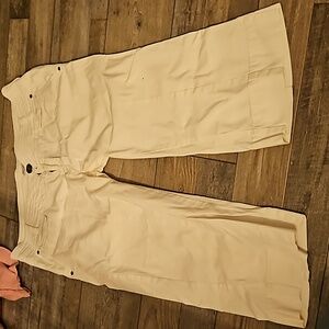 PrAna. Capris. Women's size 14. White. Has 6 pockets. 2 top buttons, and zipper